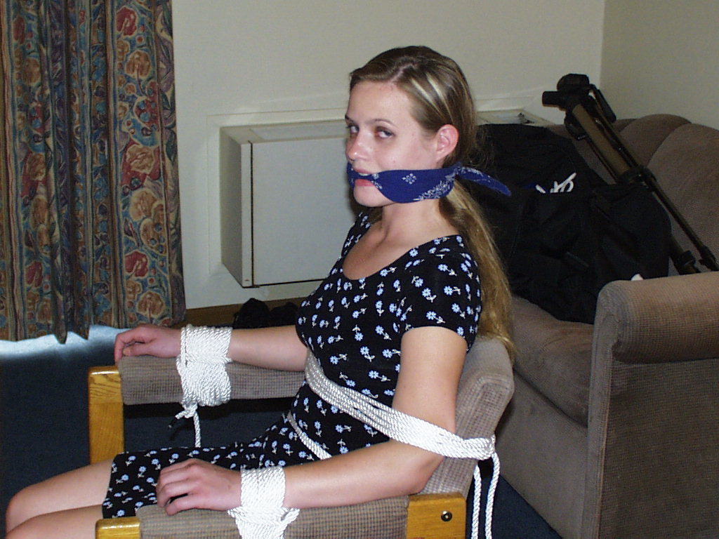 graybandanna:  Tied to a chair with a big blue bandanna gag 