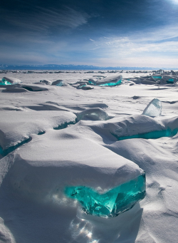 z0m:  “In March, due to a natural phenomenon, Siberia’s Lake Baikal is particularly amazing to photograph. The temperature, wind and sun cause the ice crust to crack and form beautiful turquoise blocks or ice hummocks on the lake’s surface.”