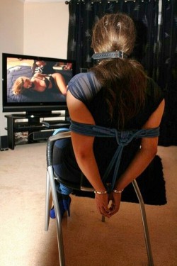 sensualhumiliation:  After her capture at her own home, the young lady was severely tied up, and her captor forced her to see videos of other captive girls and how he played with them. The “fear factor” was a appreciated value, and this way was a