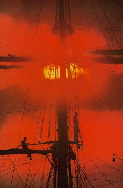 vintagenatgeographic:Sunrise behind an Argentine training ship National Geographic | June 1976