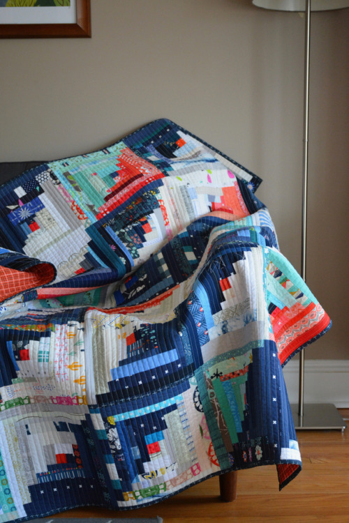 Scrappy Log Cabin Quilt: Finished!A couple weeks back, I finished the last stitches on binding my sc