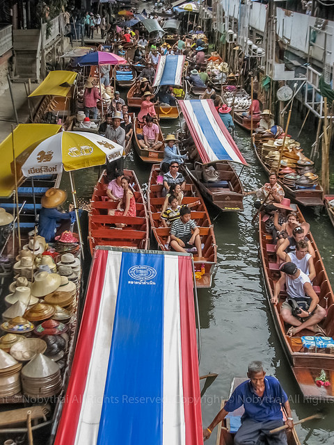 Floating Market on Flickr.
Damnoen Saduak Floating Market in Ratchaburi, Thailand, is a famous tourist attraction.