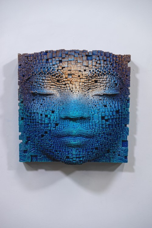 Face to FaceSculptor Gil Bruvel creates pixelated portraits from thousands of wood sticks. The anony