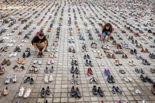 Campaigners lined up 4,500 pairs of shoes symbolizing the number of Palestinians killed by Israelis 