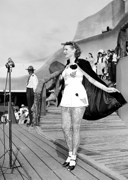 vintagegal:  Betty Broadbent, the tattooed lady, takes the stage in the first televised beauty contest at the World’s Fair’s Cavalcade of Centaurs, New York, 1939 (via)