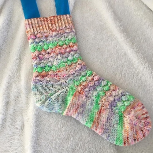 One sock is finished. I think I was subconsciously willing on spring with the color selection.  #kni