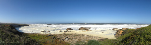 Froth A bright but windy day brings white water crashing into a cove at Pescadero, CA. Swept panoram