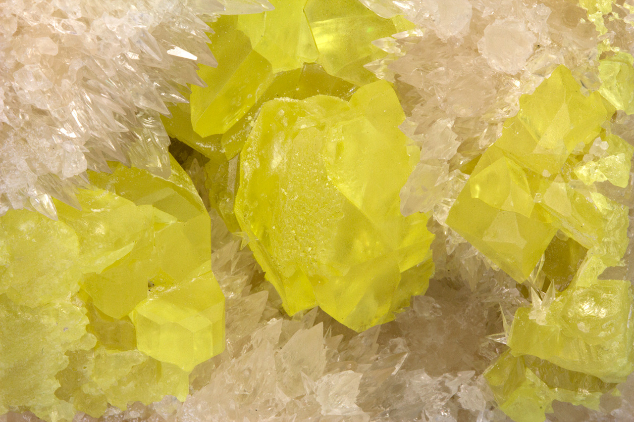 fuckyeahmineralogy:  Sulfur with Calcite; Boling Dome, Texas 