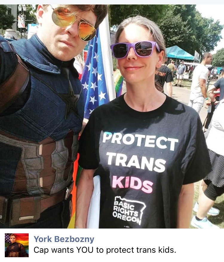 starcaptainyork:  nezumiko:  crewdlydrawn: mystrangedarkson:  nezumiko:  EPIC Photo from Portland Pride 2019 © The Oregonian [Photograph of a man dressed as Captain America, from behind with his shield on his back, waving a rainbow-striped American flag]