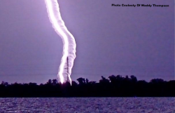 sixpenceee:  Lightning inside a waterspout. 