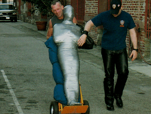 masterboibinder:  MMMMMMPPPPPPHHHH?!?!? Scott was more than a little freaked out when he awakened to find himself nearly fully encased in the restrictive mummifying wrap. He didn’t have much time to process the bizarre circumstances of his abduction