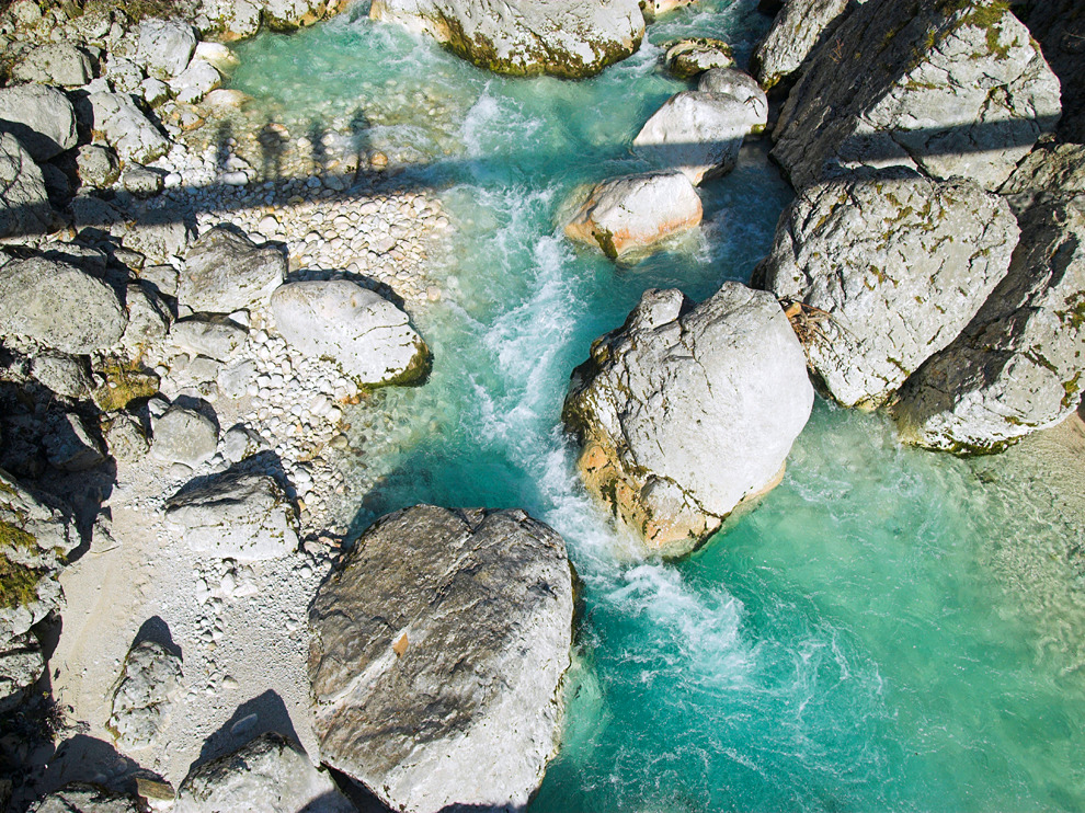 natgeotravel:  Silhouettes are hidden in the landscape near Solvenia’s Soča River