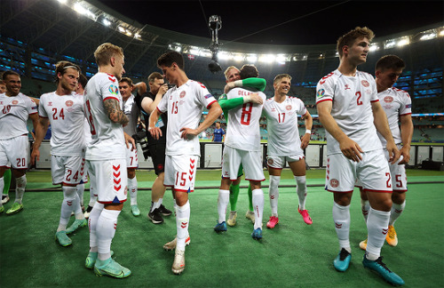 Players of Denmark celebrate their victory after the match vs. Czech Republic