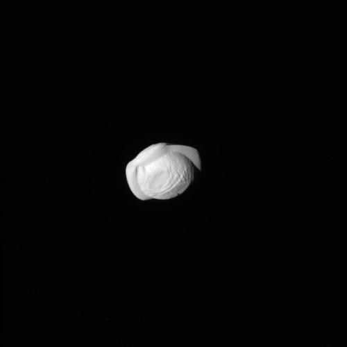 explorationimages: Cassini: Saturn’s tiny moon Pan, March 7th 2017. Pan orbits in the Encke Ga