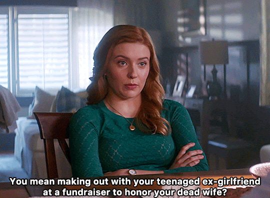 GIF FROM EPISODE 1X06 OF NANCY DREW. NANCY SITS AT A TABLE WITH HER ARMS CROSSED. SHE SAYS "YOU MEAN WHEN YOU MADE OUT WITH YOUR TEENAGED EX-GIRLFRIEND AT A FUNDRAISER TO HONOR YOUR DEAD WIFE?"