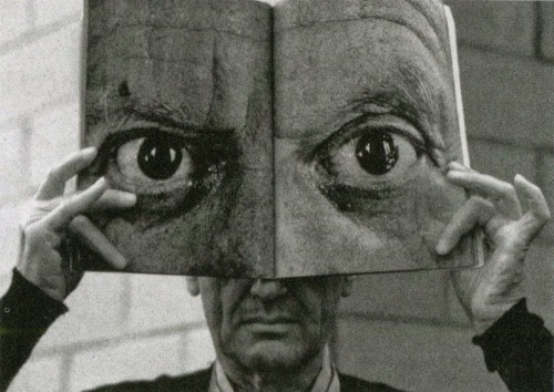 the-night-picture-collector: Inge Morath, Charles Eames posing with a Mask of Picasso’s Eyes, 1959