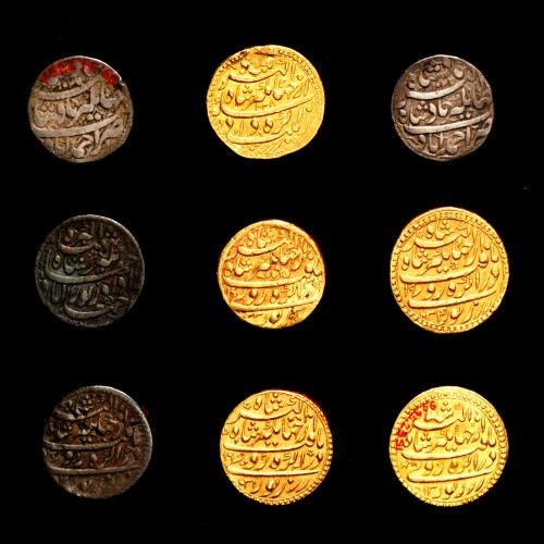 Coins with symbols of the zodiac, an idea the emperor recorded in his journals.    Minted in India d