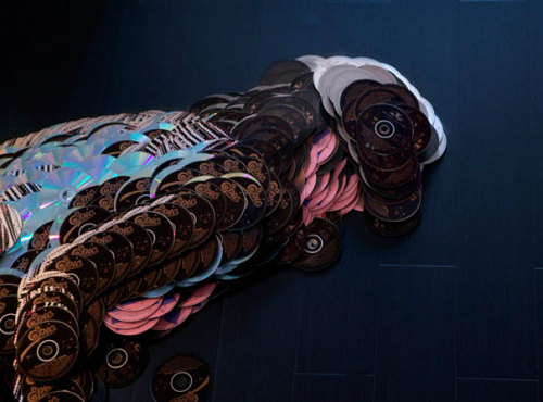 gaksdesigns:  Musician Portraits Made Of Their Own CDs. Artists Mirco Pagano and Moreno De Turco spent more than 200 hours lining up the CDs to achieve a realistic look. What’s incredible is that they used not just some random colorful CDs, but musicians’