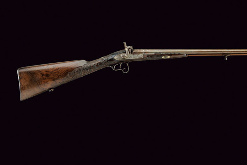An engraved muzzleloading percussion shotgun originating from Brazil, mid 19th century.  Signed “TRO