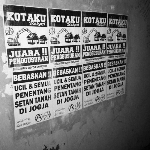 Anarchist posters in Bekasi, Indonesia. The tops poster denounces evictions of poor residents by the