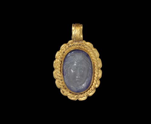 Roman gold and chalcedony intaglio gem pendant depicting a female face, possibly Medusa, c. 2nd-3rd 