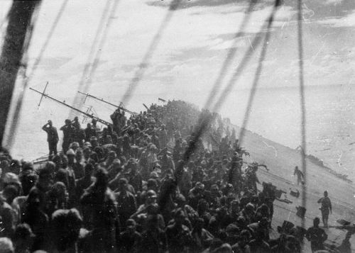historicaltimes:  The crew of the Japanese carrier Zuikaku salute the flag as it is lowered on the sinking ship, 25 October 1944. via reddit 