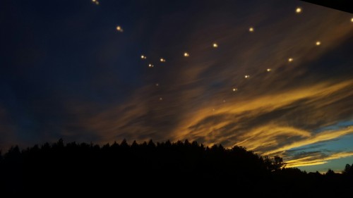 groovyherbs:  thesevibesseemfine:  penizpizza:  The lights in my room reflected from my window and looked amazing in the sky   Aliens  This is enchanting