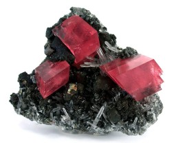 fuckyeahmineralogy:  Rhodochrosite, Quartz, Tetrahedrite; Sweet Home Mine, Alma District, Colorado