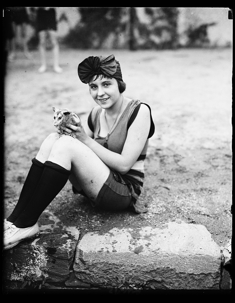 weirdvintage:  Mildred Katleck and opossum at bathing beach, 1922 (via Library of