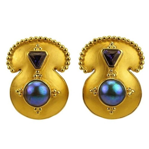 Sumptuous gold surrounding cultured pearls and purple sapphires. Earrings by Paula Crevoshay. 