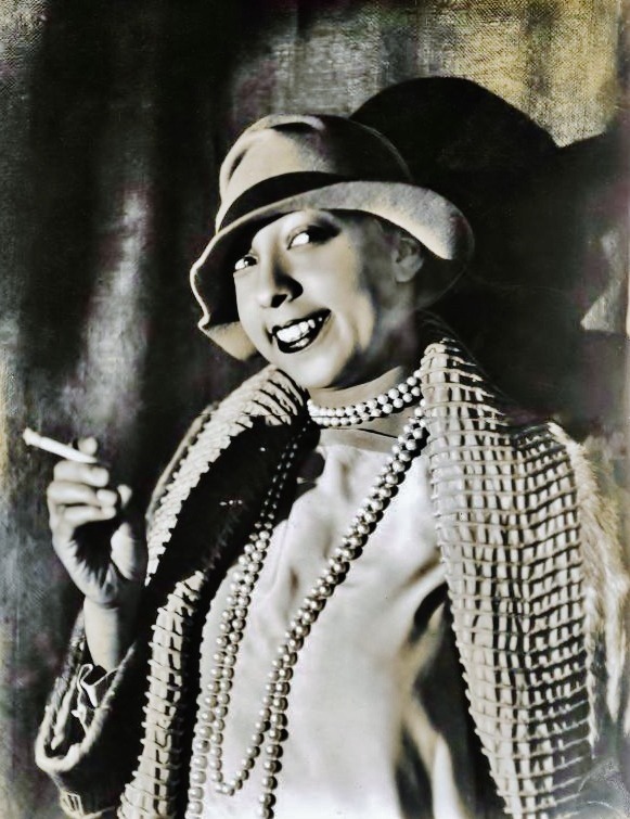 Josephine Baker, pearls & hat & cig, 1920s.