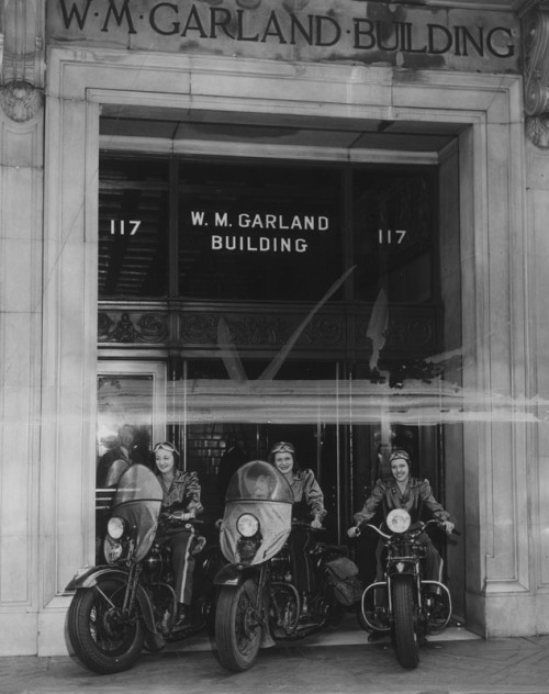 “The first female motorbike messengers for the aircraft industry are these silken-clad misses who speed inter-organization communications from Los Angeles headquarters to the three Timm plants. All professional riders, left to right–Chief Messenger...