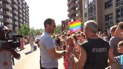 thornescratch: Braden Holtby doling out beads and high fives and general good vibes. (Source)
