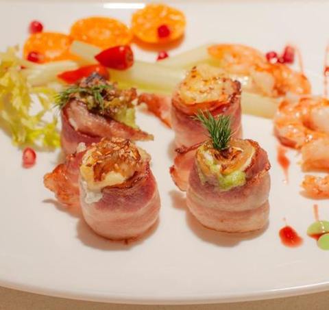 Shrimp Wrapped In Bacon With Mandarin Wedges And Pomegranate