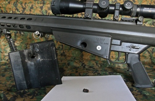 ltclaws:  boss-of-the-plains:  gunrunnerhell:  Still works… Scout sniper codename “Cool Breeze”, a member of the Marine Special Operations Team (MSOT) with his Barrett M107 SASR that sustained a direct hit in the magazine well from a PKM’s 7.62x54R