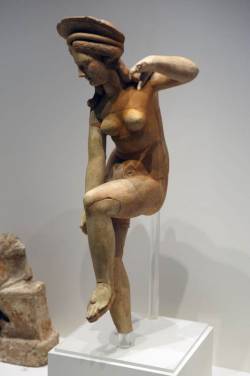 coolartefact:  Teracotta figurine of Aphrodite removing her sandal (late 4th-early 1st BCE century). Pella Museum, Greece Source: https://imgur.com/MZQ9H0o