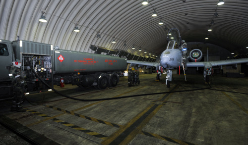 titanium-rain:Above, an A-10 Thunderbolt II sits in a hangar prior to being prepped for launch Dec. 