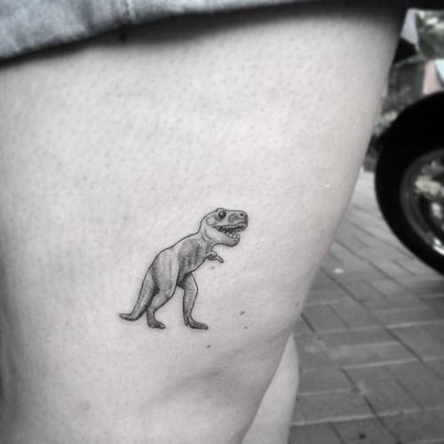 Sarah&rsquo;s little t.rex #Tattoolife #darkartists #tattoodo #Trad_tattooflash #expertblackwork #ta