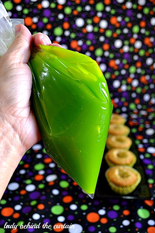 ugly–cupcakes:Slime Filled Coconut Lime Halloween Cupcakes