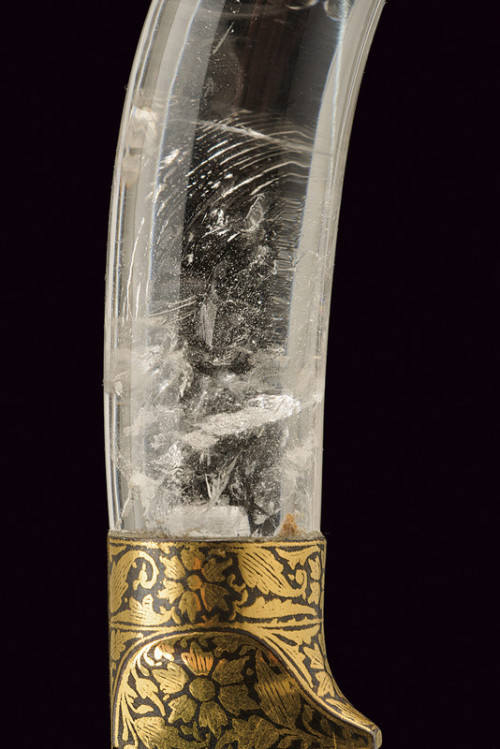 art-of-swords:  Kard Dagger Dated: late 19th century Culture: Indian Medium: steel, rock crystal, gold, iron Measurements: overall length 30.5 cm The dagger has a straight, single-edged blade of damask steel, decotated with koftgari gold inlays depicting