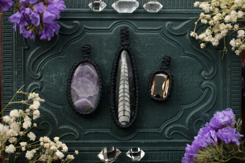 Amethyst, faceted smoky quartz and orthoceras fossil macrame pendants made with black cotton yarn. A