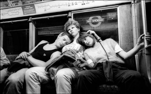 32 candid photographs of the London Underground in the late 1980s.