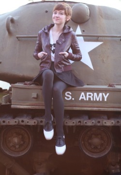 tightsobsession:  Sitting on an army tank in black tights. Tights week starts November 3rd! 
