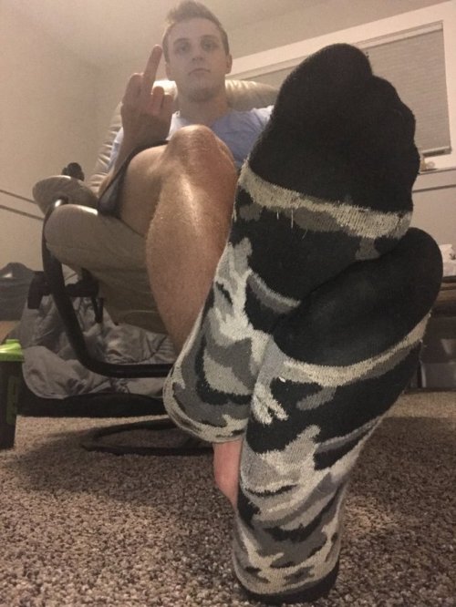 Sweaty Alpha cammo socks. Get in there and sniff while he kicks back ignores and drinks his protein 