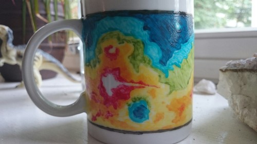 magnetospheric:I painted a mug based on the MOLA topographic map of Mars. It was so much fun! The bo