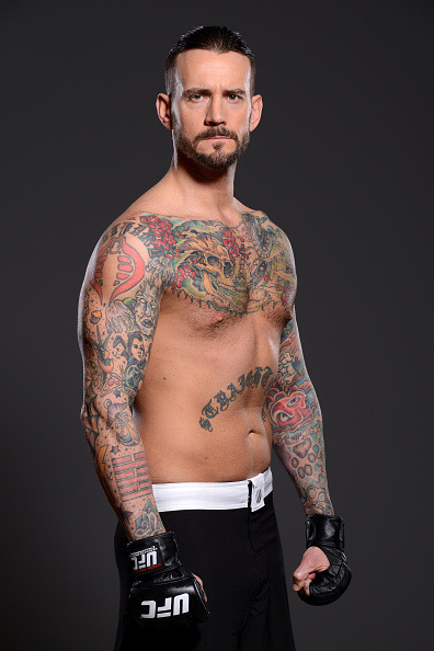 thepunknation:UFC Photoshoot Part One‘DALLAS, TX - MARCH 13:  Phil ‘CM Punk’ Brooks poses for a  photo during a UFC photo session at the Hilton Anatole Hotel on March  13, 2015 in Dallas, Texas. (Photo by Mike Roach/Zuffa LLC/Zuffa LLC via  Getty