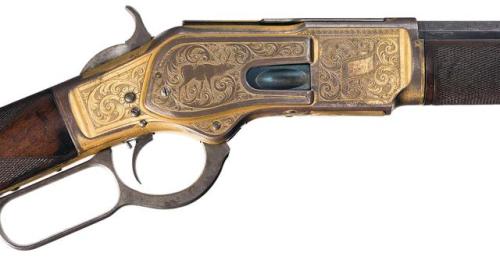 Winchester Model 1873 “1 of 1,000″ lever action rifle engraved by John Ulrich.Sold at Auction: $414,