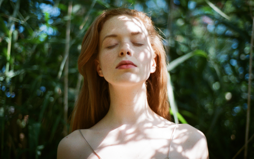 unusualyoung:  Mind is Racing \ by PAM LAUModel: Sierra St LouisPhoto by Pam LauRiverdale Park, Toronto.Nikon FG50mmKodak Gold 400