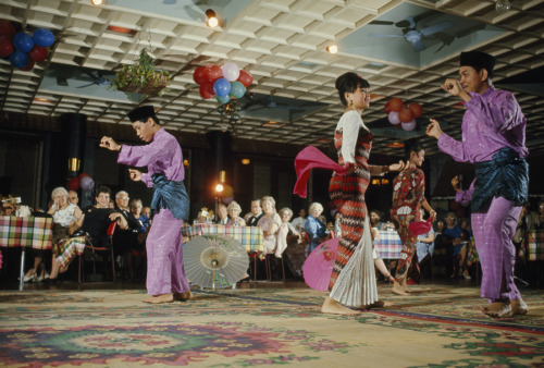 Malays in traditional dress dance for guests at the Raffles Hotel in Singapore, August 1966.Photogra