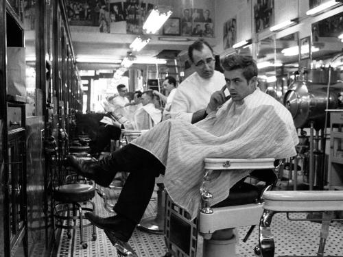 blondebrainpower:James Dean at a barber shop near Times Square, New York, 1955.Photographed by Dennis Stock